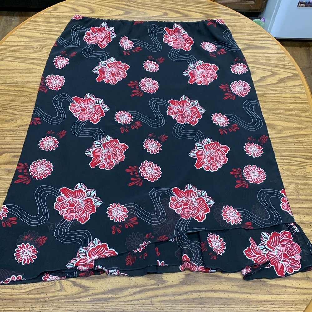 Long modest black skirt with red and white flower design Rebecca Jones skirt.